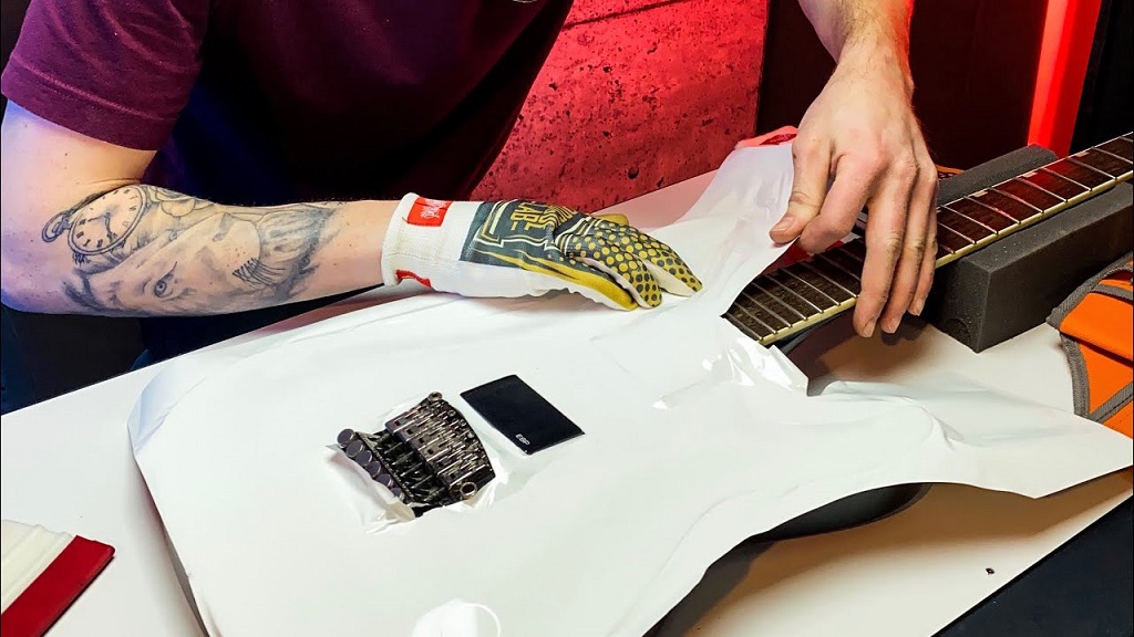 How to Play Guitar and the Art of Gift Wrapping a Guitar